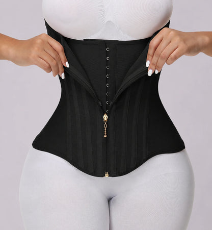 Close-up product view of a black waist shaping corset featuring layered compression fabric, front hook-and-zip closure, vertical boning support, and a curved hem design for enhanced waist definition.
