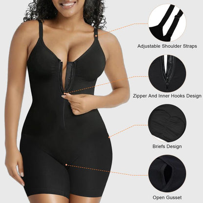 Model wearing a fitted black bodysuit featuring a sculpting silhouette, front closure, adjustable shoulder straps, fitted shorts-style bottom, and open gusset detail.