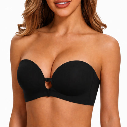 Studio close-up of a model wearing a black strapless bra featuring smooth molded cups, a centered front clasp, and a clean supportive band.