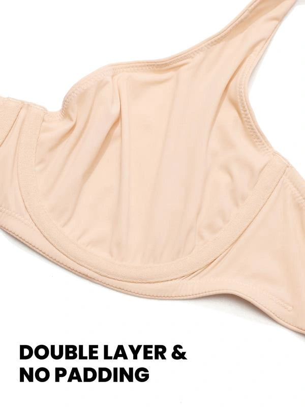 Close-up of a nude-colored bra showing its double-layer construction, smooth fabric, molded cup shape, and unpadded interior design.