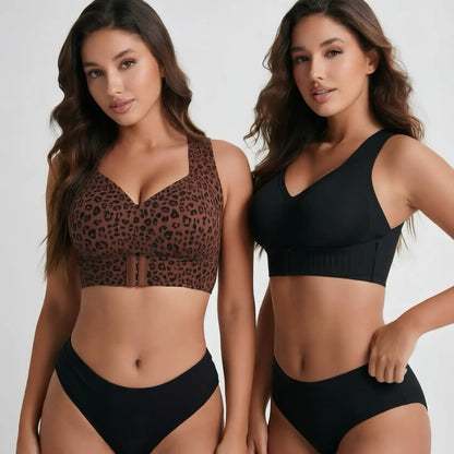 Two models wearing supportive bras in leopard print and solid black, showcasing V-neck designs, wide shoulder straps, structured underbands, and front closure details.