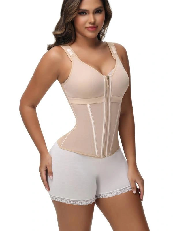 Model wearing a beige compression bodysuit with a built-in bra, front zipper closure, structured waist panels, and adjustable shoulder straps.
