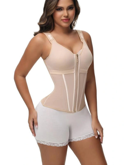 Model wearing a beige compression bodysuit with a built-in bra, front zipper closure, structured waist panels, and adjustable shoulder straps.