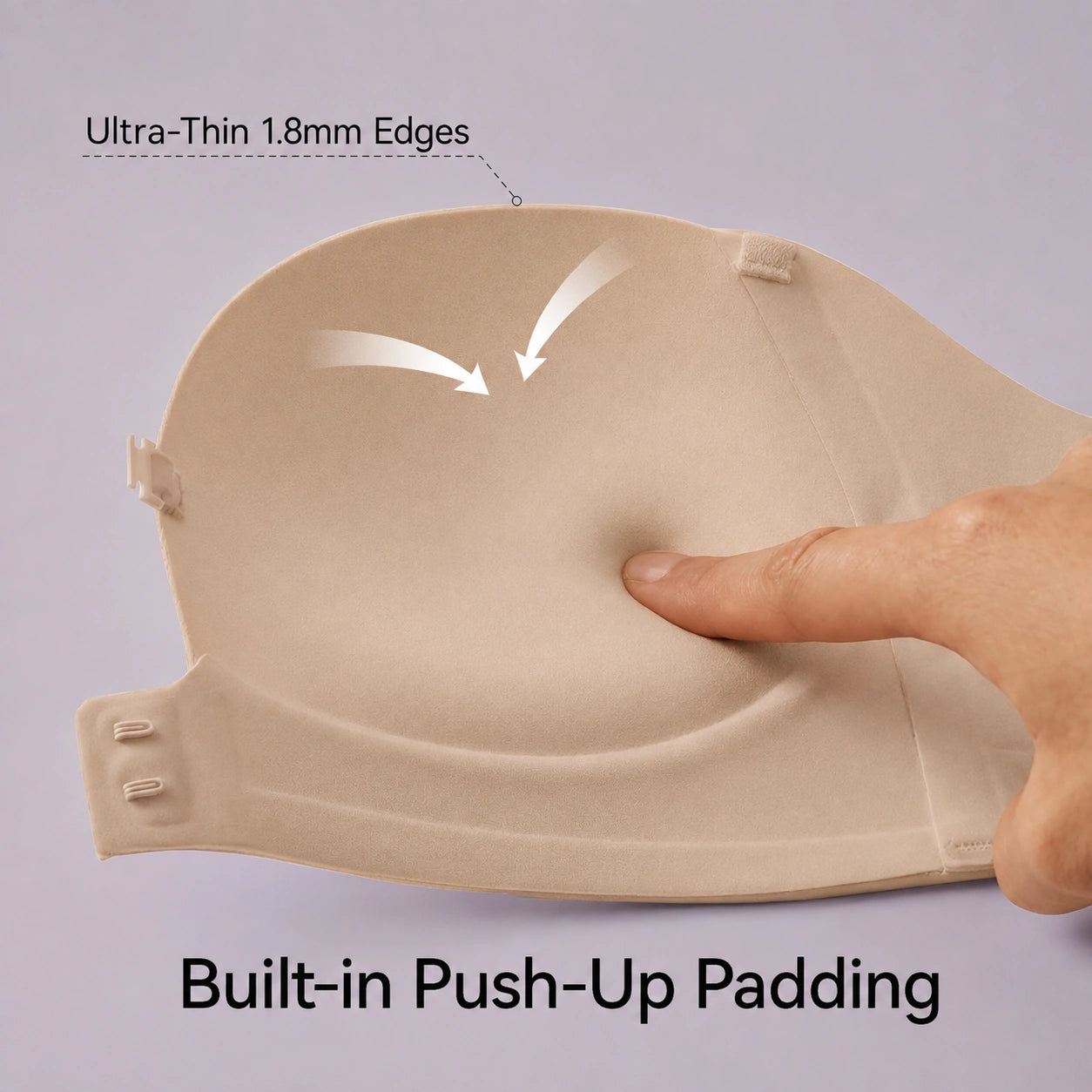 Close-up of a nude molded bra showing 1.8 mm thin edges, integrated push-up padding, a smooth seamless surface, and a flexible band designed for a discreet fit under clothing.