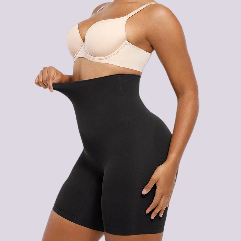 Black tummy control shaping shorts with waist compression and smooth side contouring
